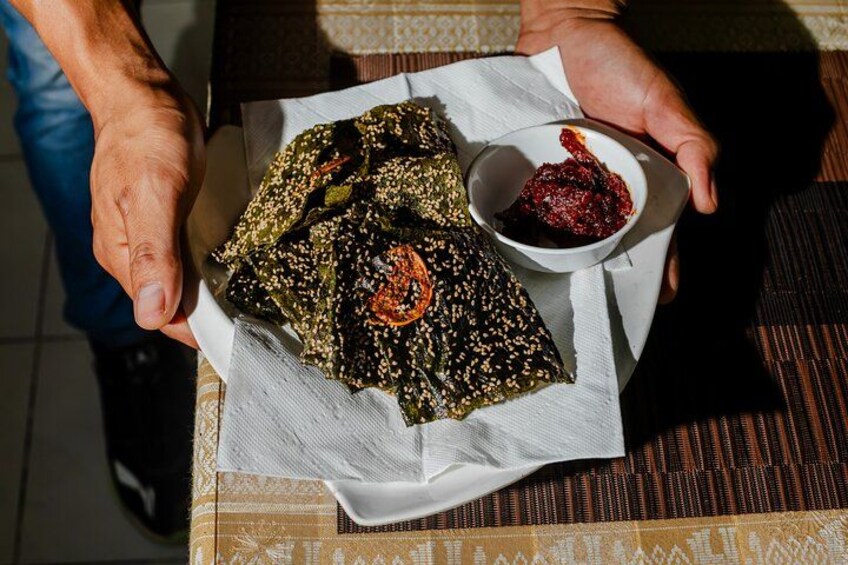 Crispy khaipean river algae, flash-fried and coated in sesame seeds, served with a punchy jaew bong chilli dip 3