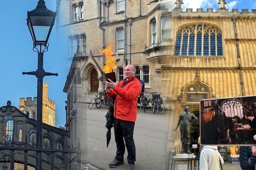 A person in a red jacket holding a book and a flaming object in front of a historic building with a large arched window and a statue. 1