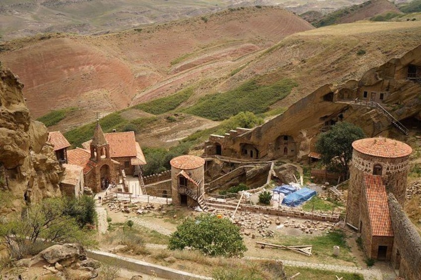 A village with traditional architecture nestled in a mountainous landscape. 2