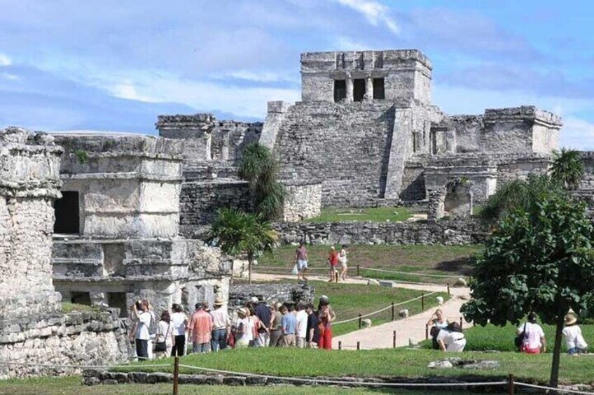 Ancient ruins with tourists exploring. 2