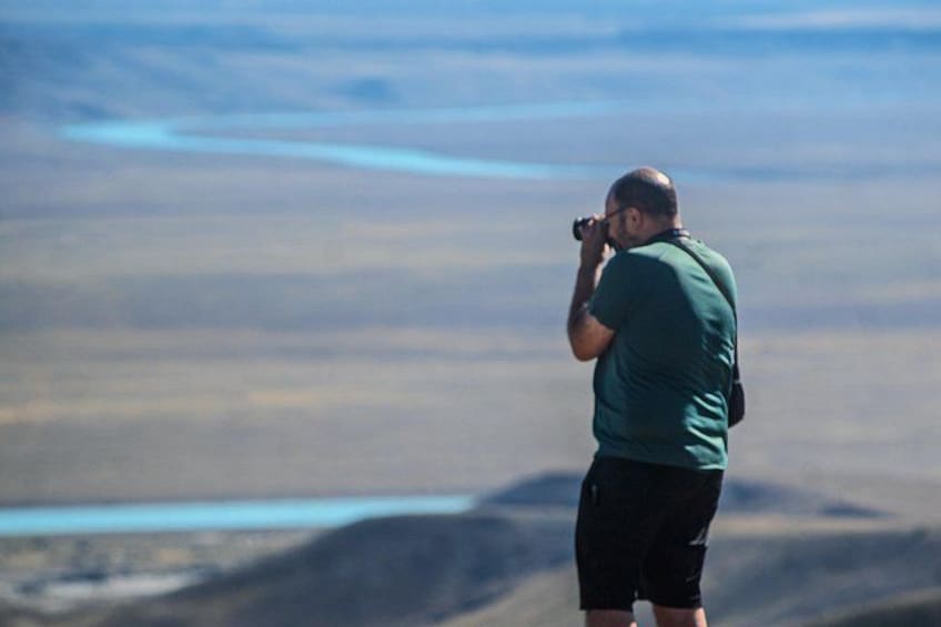A person taking a photo with a camera. 2