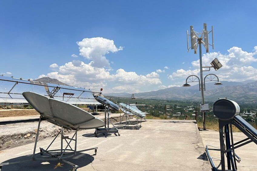 Solar panels, communication towers, and a mountainous landscape. 5