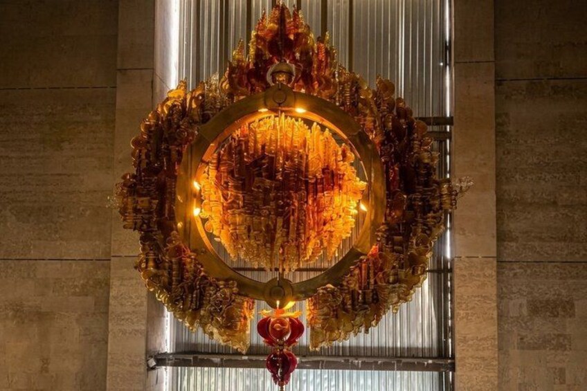A chandelier with intricate designs and lights. 4