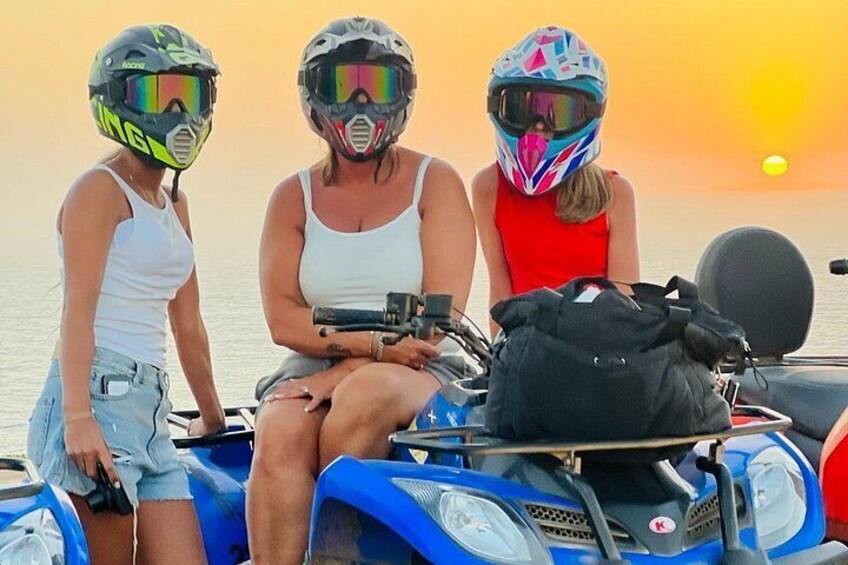 Three people on a jet ski at sunset. 2
