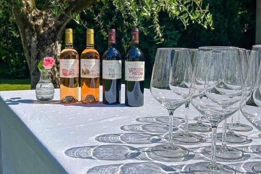 A table with wine bottles and glasses. 5