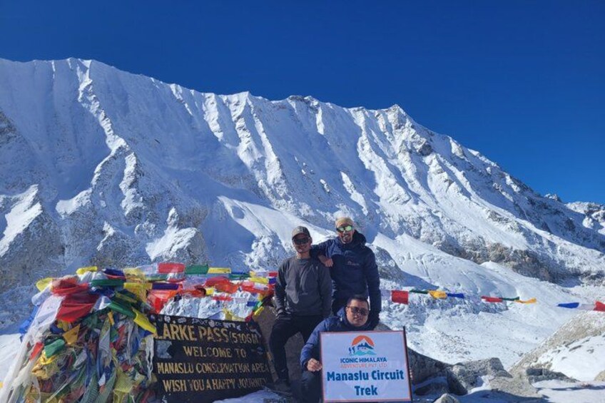 A mountainous landscape with a sign reading 'Manaslu Circuit Trek.' 3