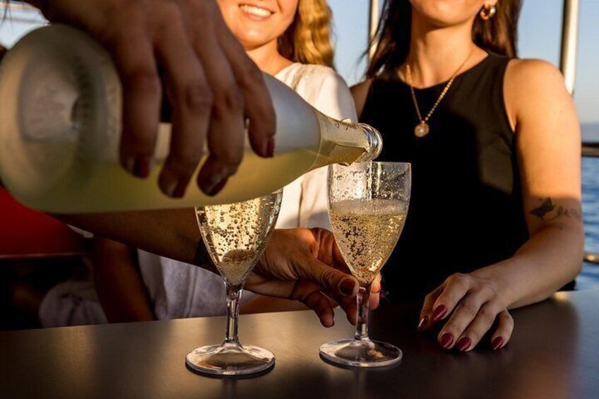 A person pouring a drink into a glass. 5
