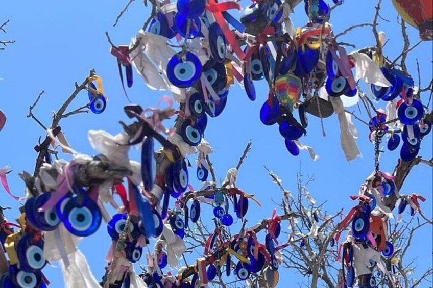 A tree with colorful decorations, including blue and white circular patterns. 2