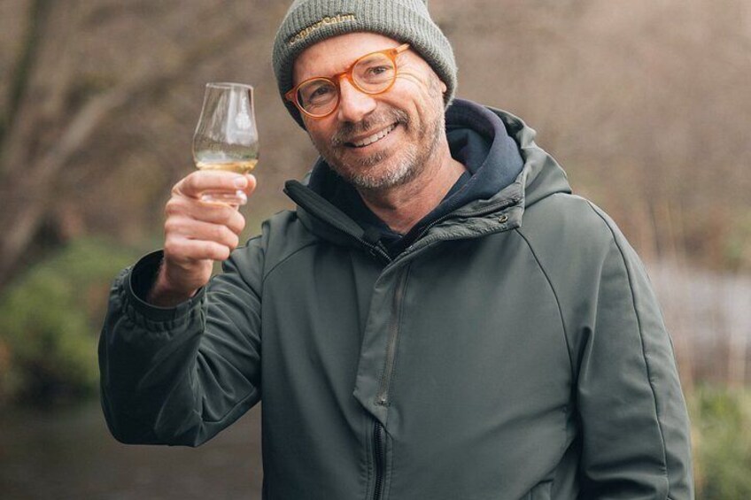 A person holding a wine glass. 3