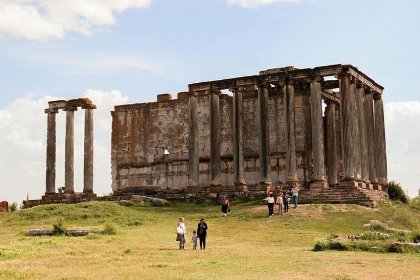 Ancient ruins with columns and a partially intact structure. 5