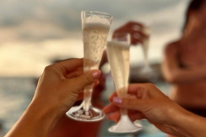 Two hands holding champagne glasses. 4