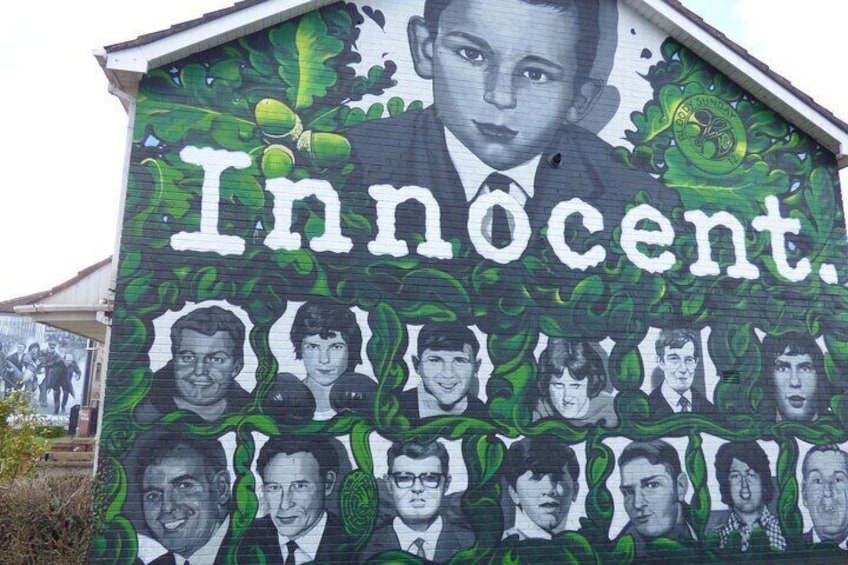 A mural with the word "Innocent" and multiple portraits. 2