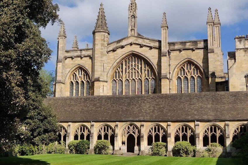 A historic building with arched windows and a large central archway. 2