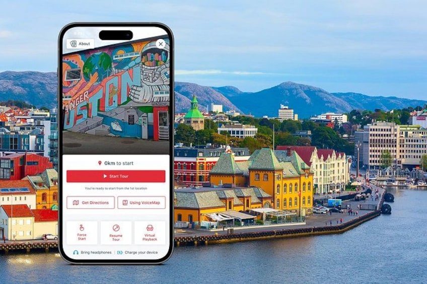 A smartphone displaying a cityscape with colorful buildings and a waterfront. 1