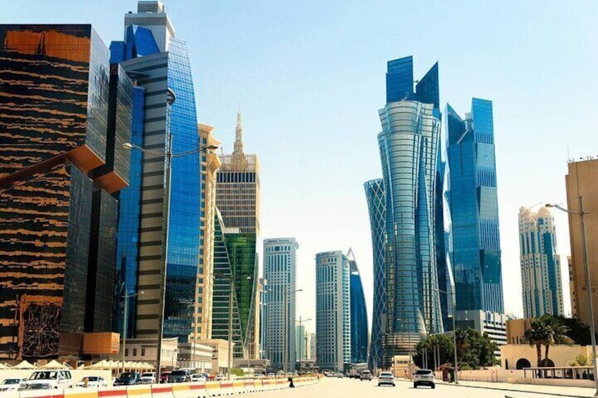 A cityscape with modern skyscrapers and a busy street. 2