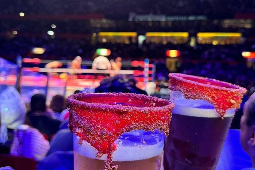 Enjoy the function like a real local: with a michelada and the best view to the ring 3
