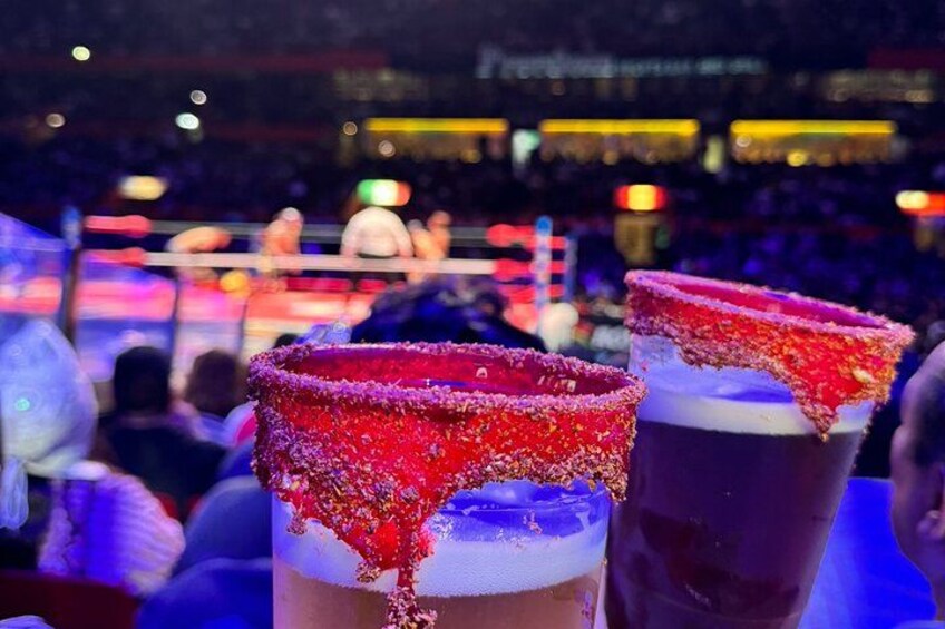 Enjoy the function like a real local: with a michelada and the best view to the ring 3