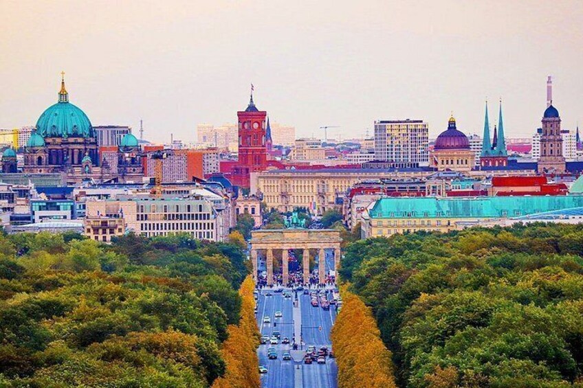 A cityscape with prominent buildings, including a large dome and spires, and a river running through the center. 5