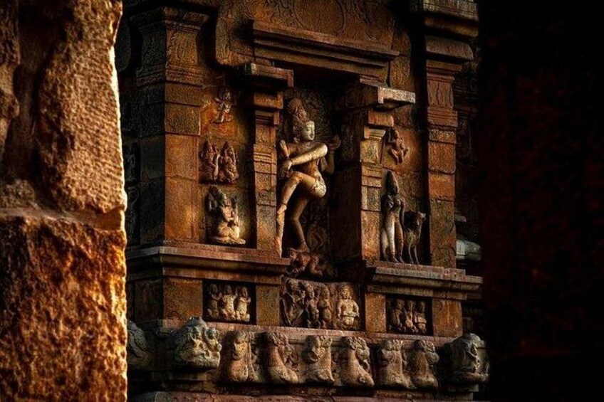 Ancient stone carvings and sculptures on a temple wall. 1
