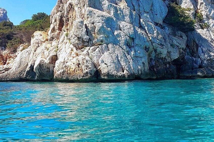 A rocky coastline with clear turquoise water. 2