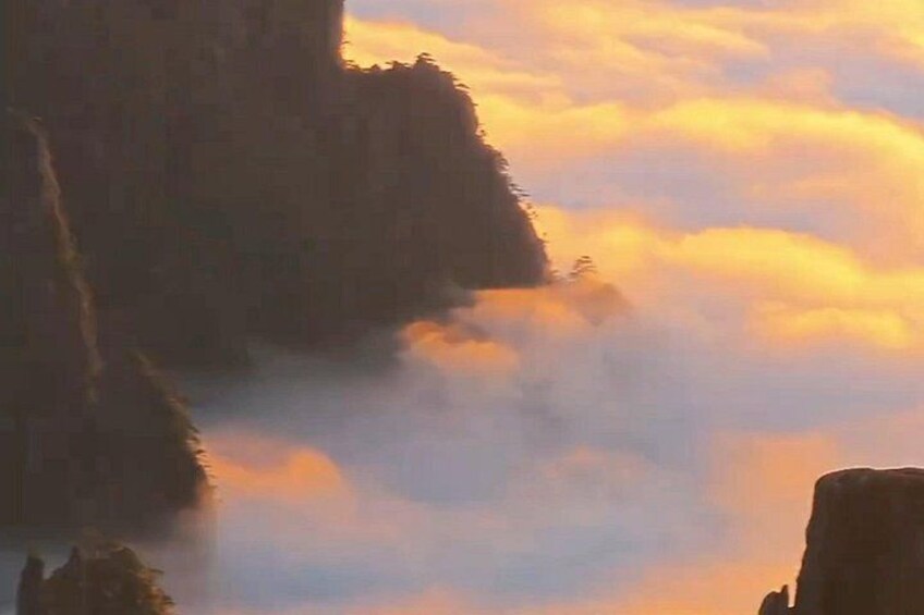 A mountainous landscape with clouds. 3