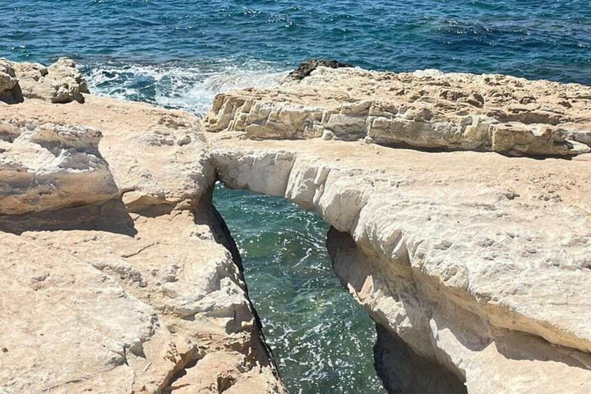 A rocky coastline with a narrow water channel. 4