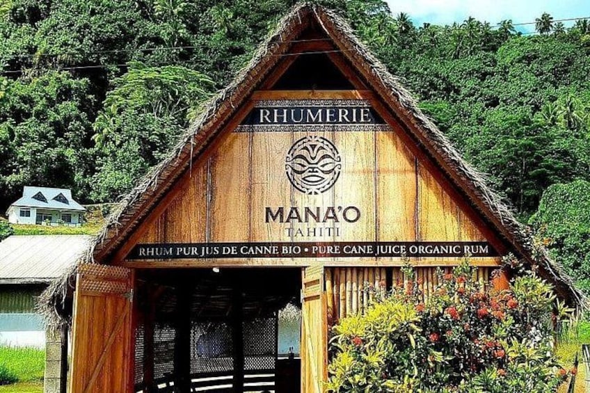 A wooden building with a thatched roof, labeled 'RHUMMERIE' and 'MANA'O TAHITI.' 4