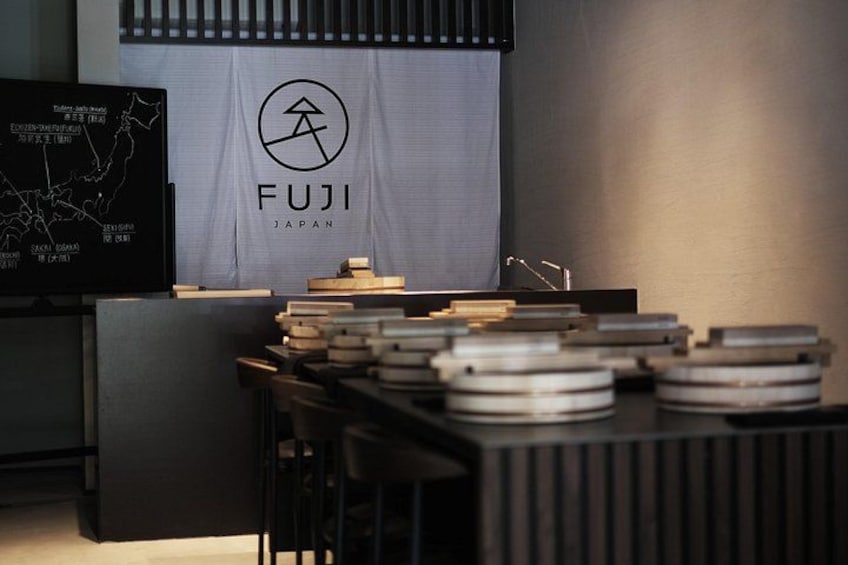 A FUJI branded display with a map and a table with stacked objects. 2