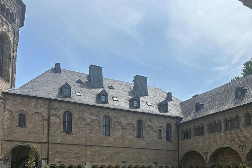 A historic building with arched windows and a brick facade. 5