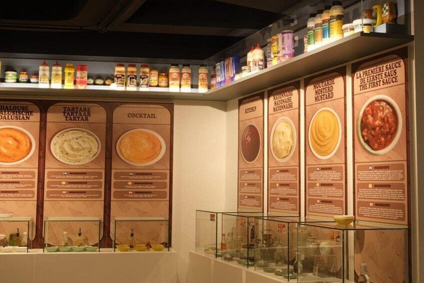 A menu board with various dishes and sauces. 2