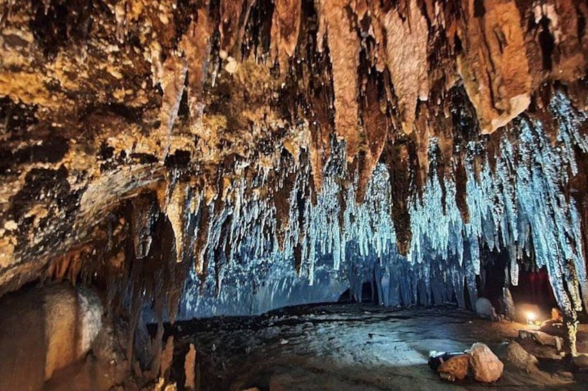 A cave interior with stalactites and stalagmites. 5