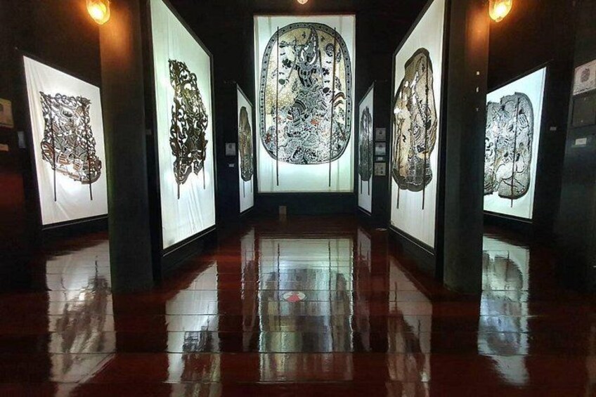 A gallery with artworks displayed on walls. 4