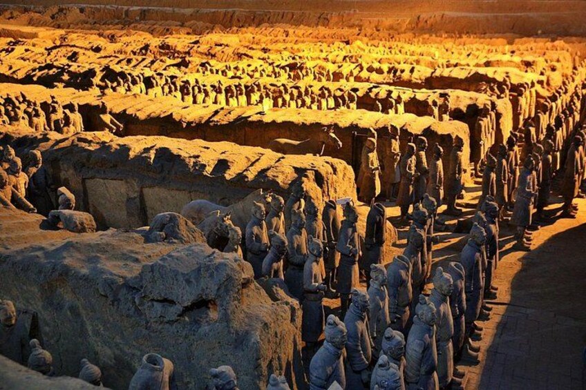 A large number of stone statues arranged in rows, likely representing a historical or cultural site. 4