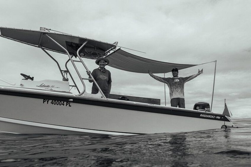 A boat with the registration PY 40004 PL on calm water. 5