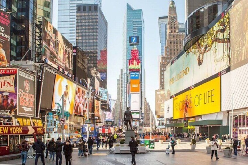 Times Square in New York City with large billboards and skyscrapers. 5