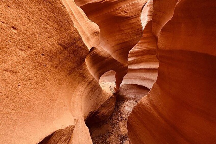 A narrow canyon with smooth, curved sandstone walls. 5