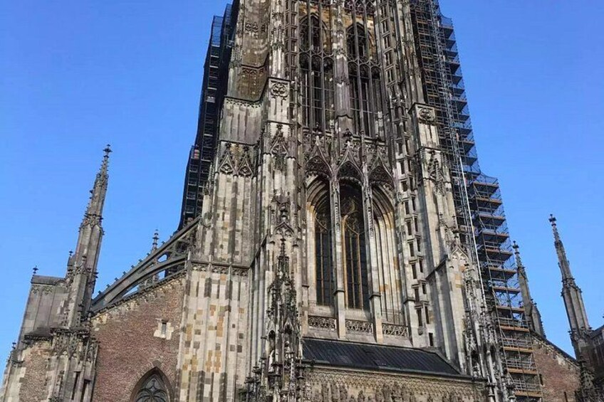 A Gothic cathedral with intricate stonework and scaffolding. 3