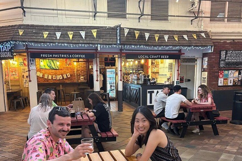 Recent guests enjoying the locally brewed beer at the Market tap. 5