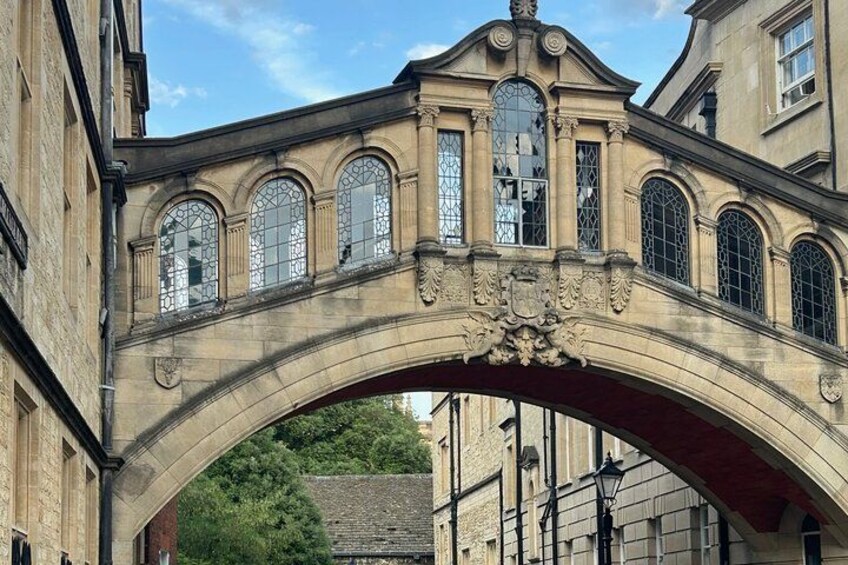 An arched stone bridge with ornate details and stained glass windows. 3