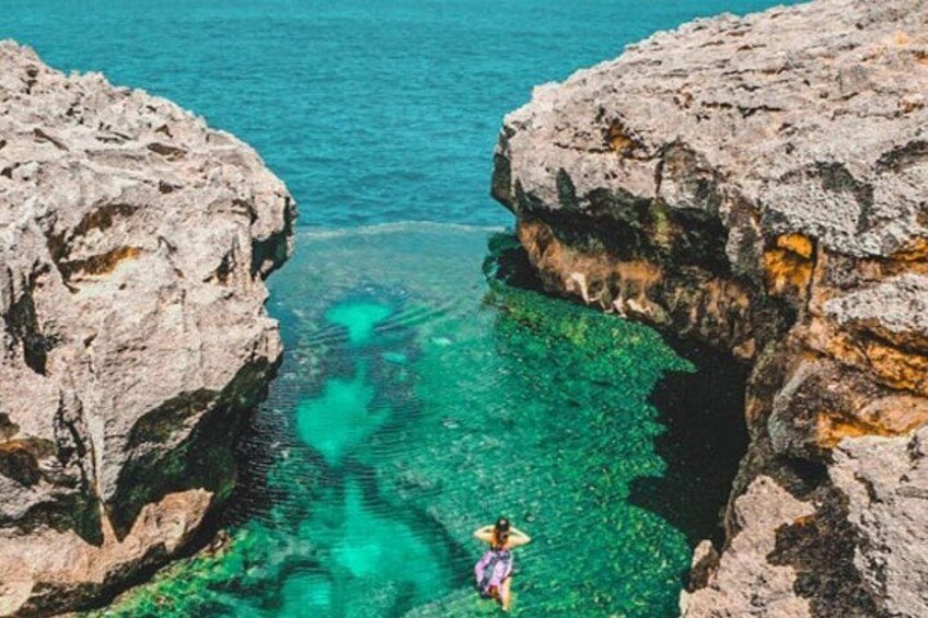Angel’s Billabong is Angel's Billabong is a natural infinity pool in Nusa... a cliff broken by ocean waves. A natural blue swimming pool nestled in the rock. 3