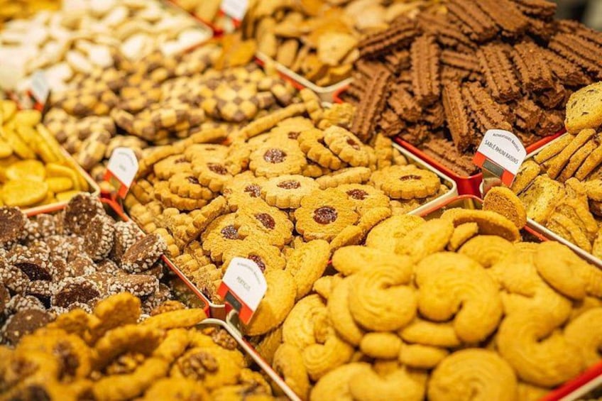 A variety of cookies and pastries displayed in trays. 3