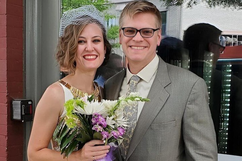 A person holding a bouquet of flowers. 4