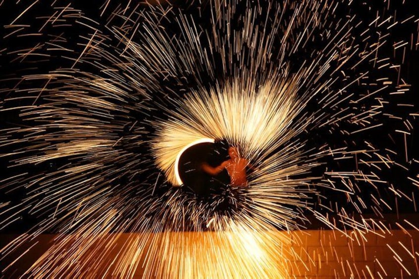 A person surrounded by sparks. 4