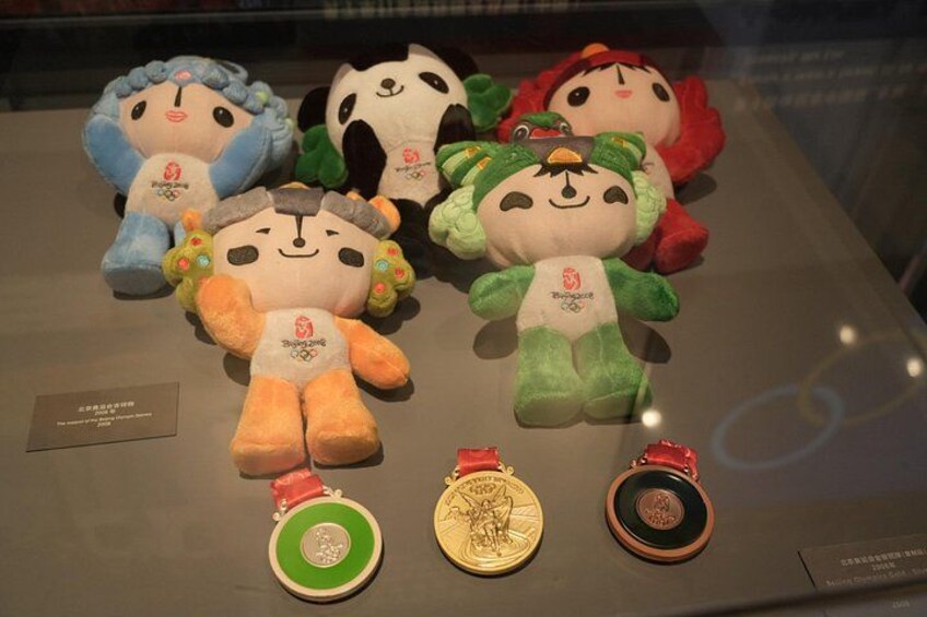 Plush toys and medals on display. 1