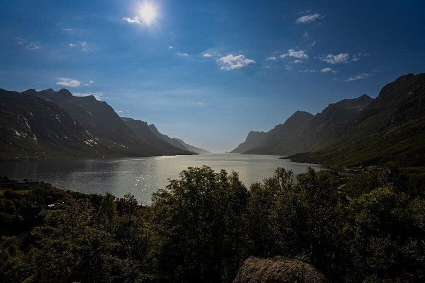 A mountainous landscape with a lake and a clear sky. 3
