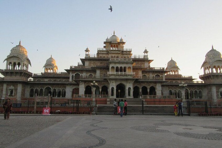 A large, historic building with multiple domes and arches. 4