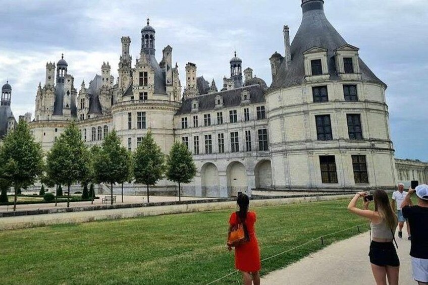 A historic castle with multiple towers and arched windows. 3