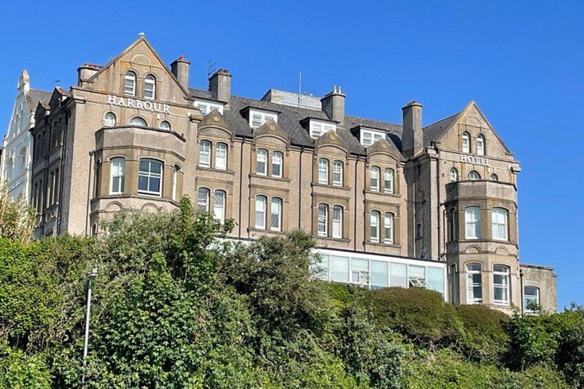 A large, historic building with the name 'Harbour Hotel' on its facade. 2