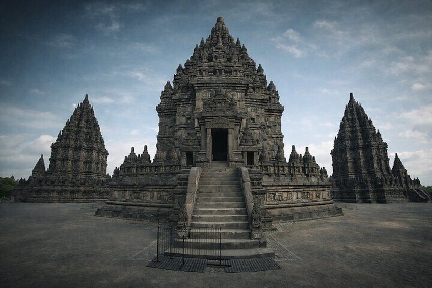 A large, ancient temple complex with multiple towering structures and a central entrance. 4