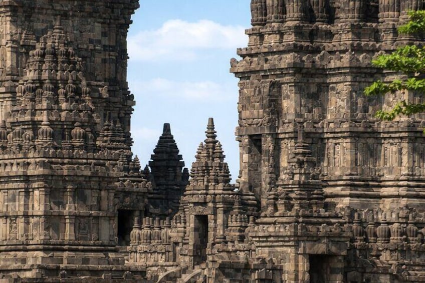 Ancient stone temple ruins with intricate carvings and multiple spires. 3